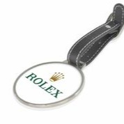Santhome Golf Legacy’s metal luggage tags, divot tools, golf balls, & golf towels make great corporate gifts at golf events